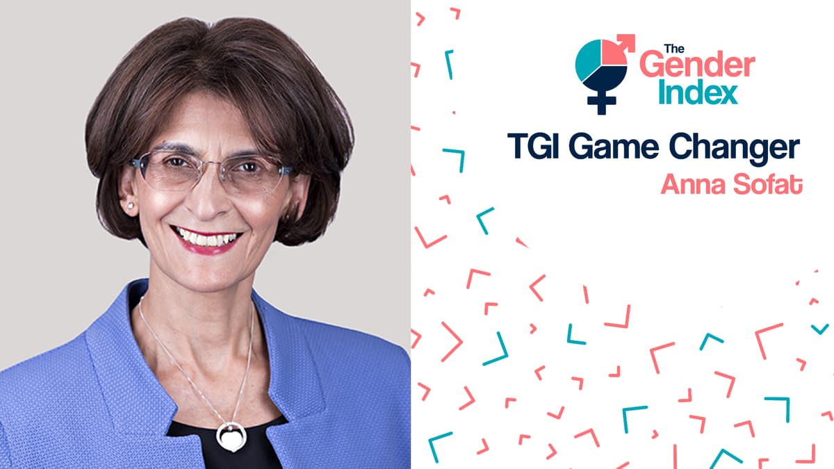 a woman in a blue jacket smiling and a logo on a white background 